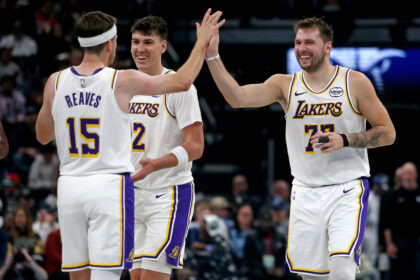 Austin Reaves, Jake Laravia, and Luka Doncic Lakers