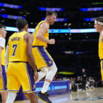 Luka Doncic, Austin Reaves, Gabe Vincent, and Jake Laravia Lakers